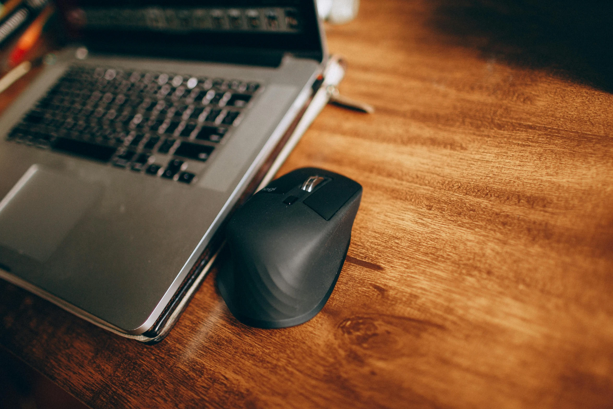 a laptop computer sitting on top of a wooden desk, scrolling computer mouse, shot with sigma f / 4. 2, thumbnail, rounded