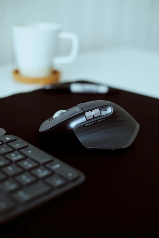 a computer mouse sitting on top of a desk next to a keyboard, thumbnail, product image