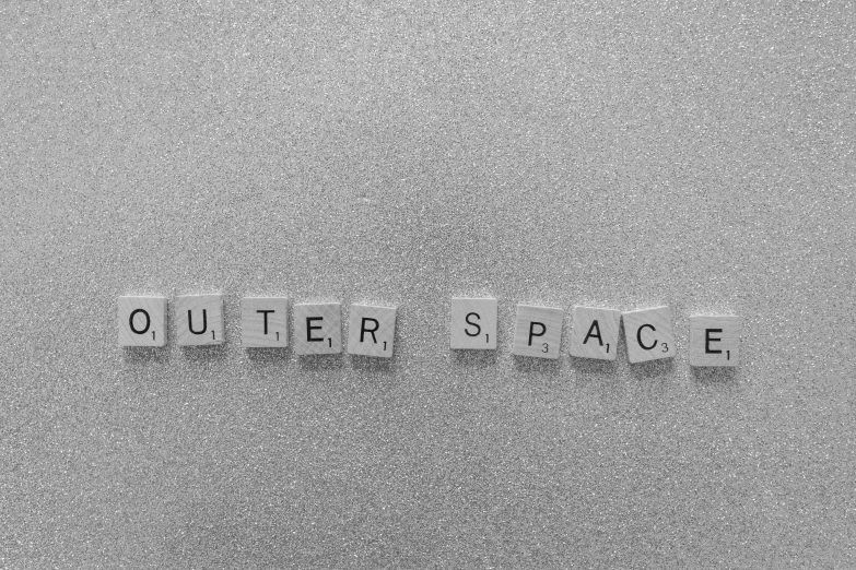 a black and white photo of the words outer space, inspired by Edward Ruscha, unsplash, light and space, office cubicle background, squares, y2k, eraserhead