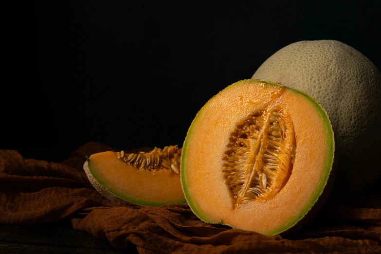 a close up of a sliced melon on a cloth, a still life, by Eglon van der Neer, pexels contest winner, light orange mist, with a black background, highly detailed product photo, slide show