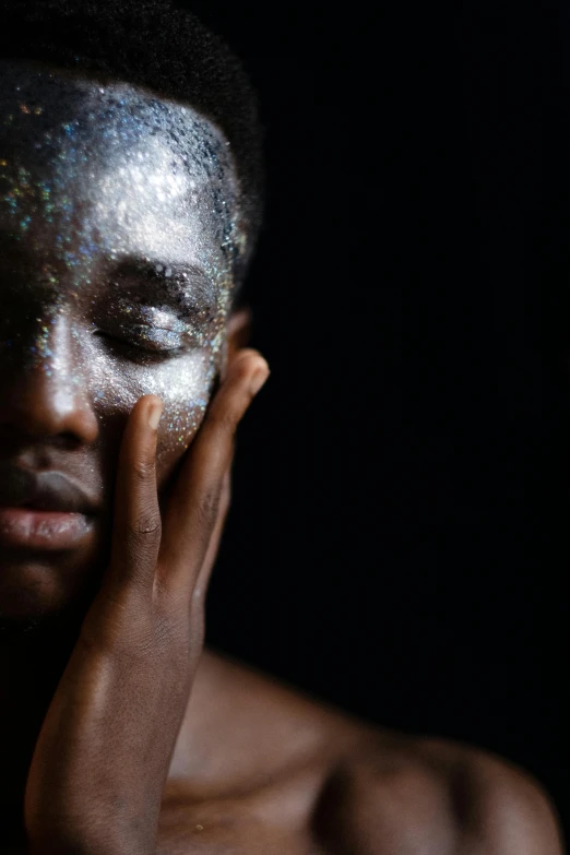 a close up of a person with glitter on their face, inspired by Gordon Parks, afrofuturism, slide show, embracing, istockphoto, translucent skin