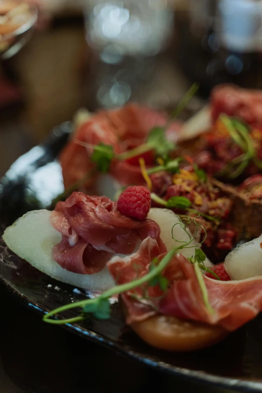 a close up of a plate of food on a table, renaissance, blushing, woodfired, thumbnail, ground level shot