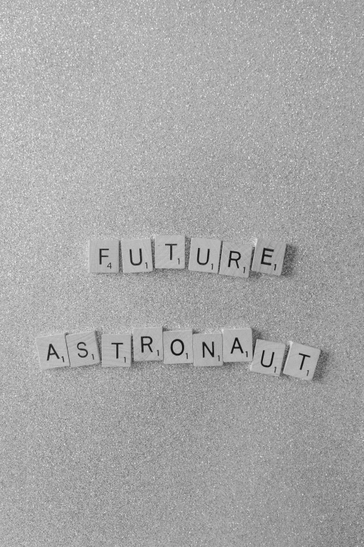 a close up of a piece of paper with words on it, an album cover, tumblr, futurism, lonely astronaut, cute future vehicles, the future, new song