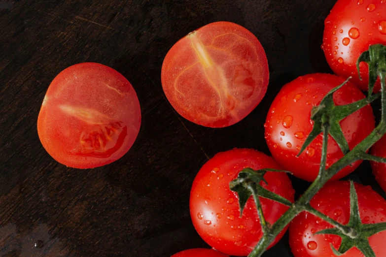 a bunch of tomatoes sitting on top of a wooden table, by Tom Wänerstrand, pexels contest winner, dewy skin, solid background, highly upvoted, semi-transparent