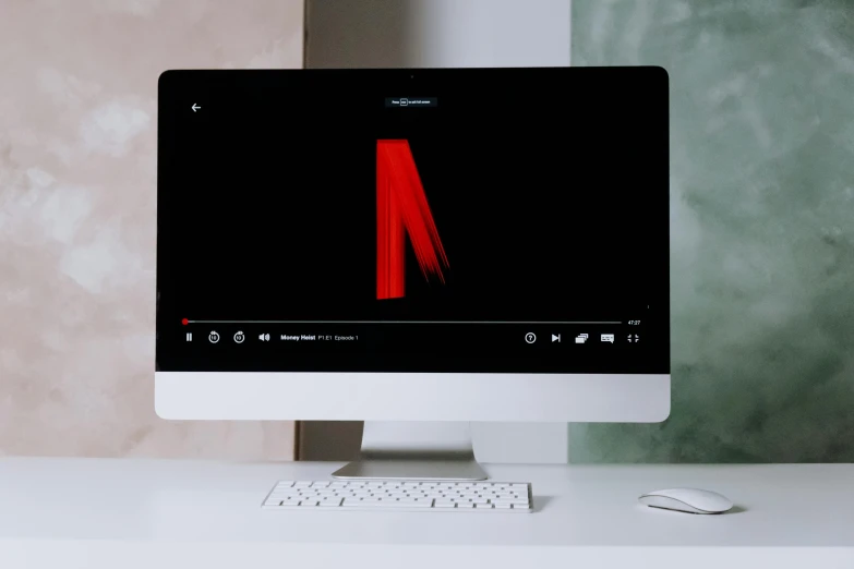 a computer monitor sitting on top of a white desk, trending on pexels, video art, netflix logo, artsationhq, ( ( theatrical ) ), a list cast