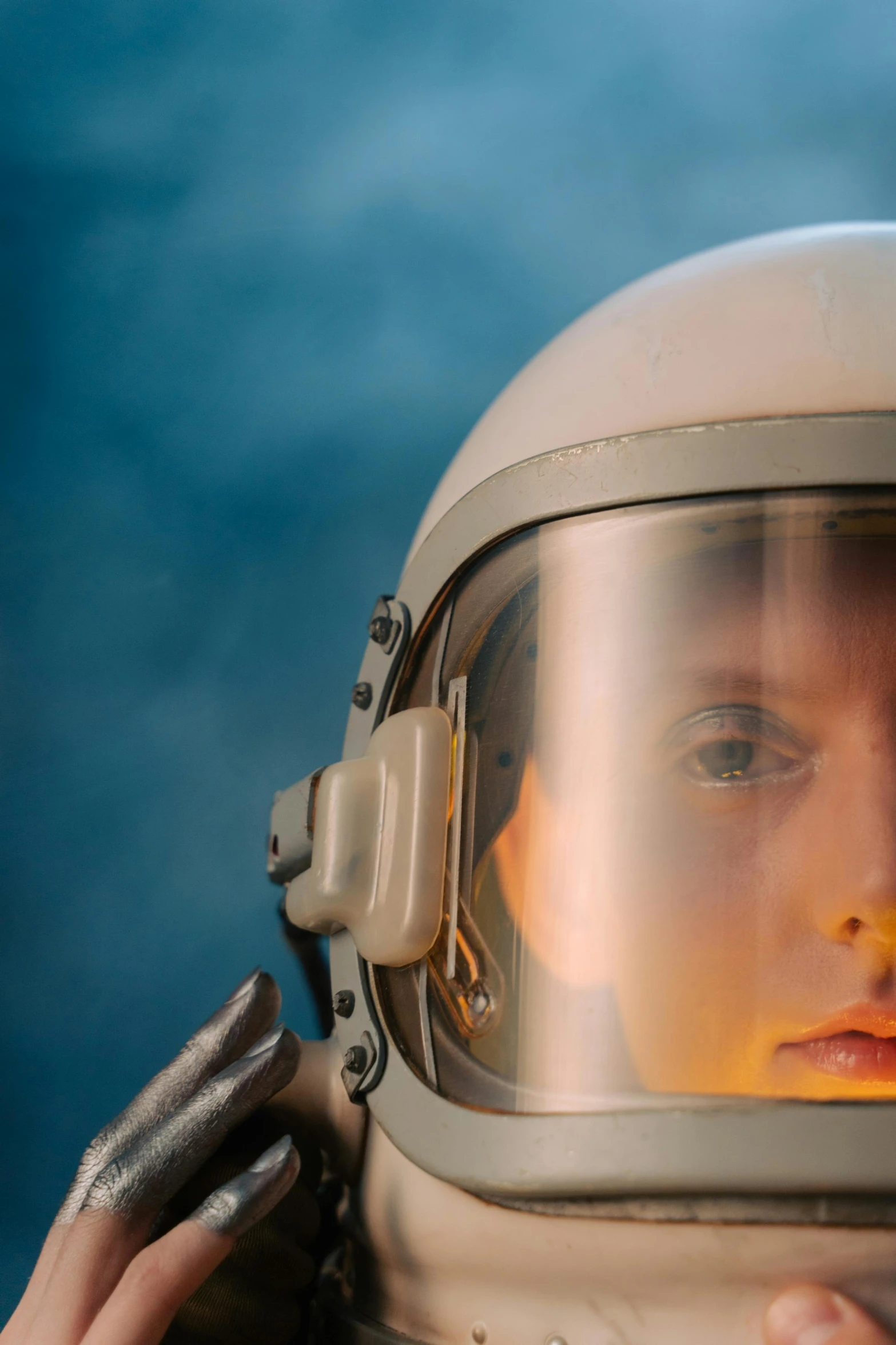 a woman in a space suit talking on a cell phone, an album cover, by Adam Marczyński, pexels contest winner, close up head shot, portrait of cute pilot girl, still from a live action movie, detail shot