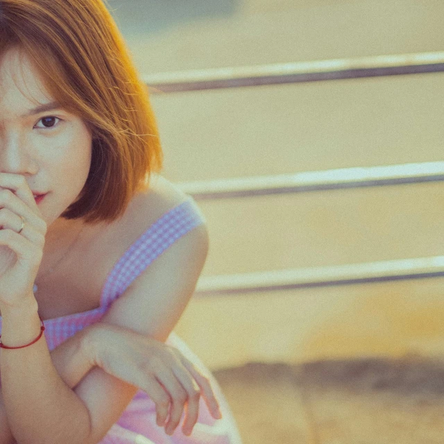 a woman in a pink dress sitting on a bench, inspired by Yu Zhiding, pexels contest winner, in girls generation, with a bob cut, retro effect, wearing a cute top