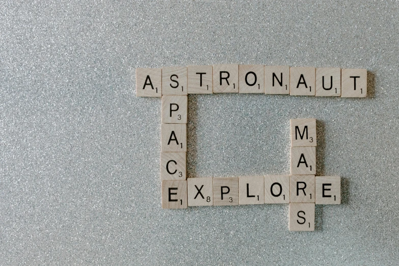 a close up of scrabbles on a refrigerator door, inspired by Vija Celmins, trending on unsplash, space art, astronaut below, andromeda, astounding stories, epic road - trip in outer space