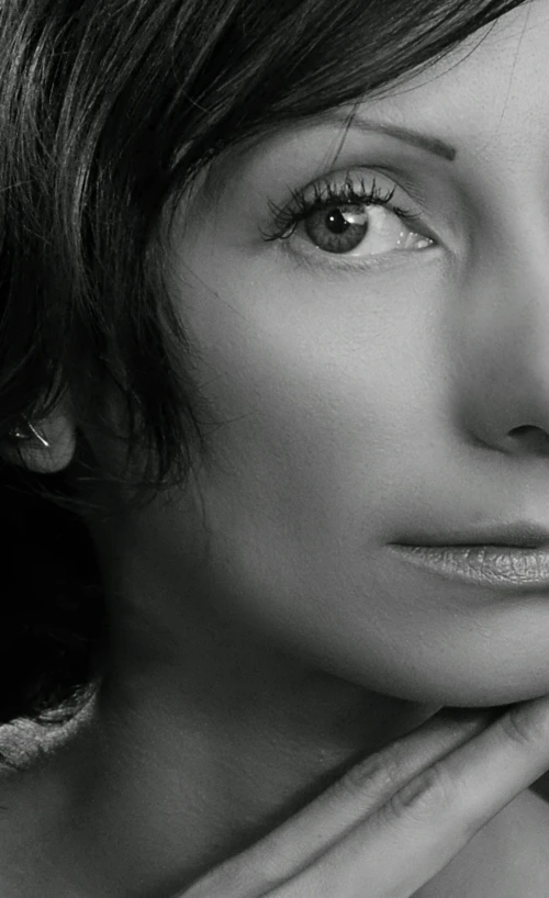 a black and white photo of a woman, black hair and large eyes, p cattaneo, side portrait imagery, a high angle shot