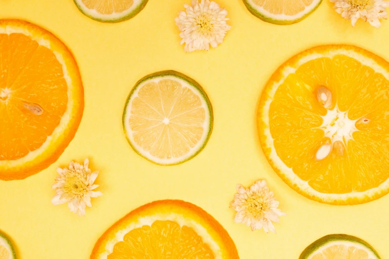 slices of oranges, limes, and flowers on a yellow background, by Carey Morris, trending on pexels, background image, skincare, 🐿🍸🍋