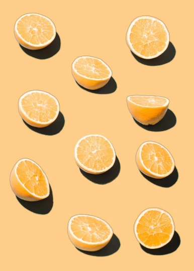 a group of oranges sitting on top of a table, by Carey Morris, trending on pexels, pop art, pale yellow wallpaper, lemonade, on clear background, image split in half