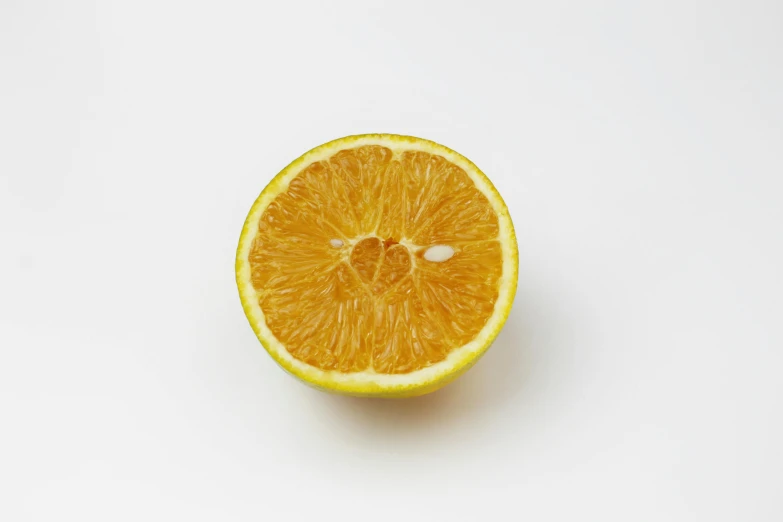 an orange cut in half on a white surface, unsplash, detailed product image, medium format, lemon, ready to eat
