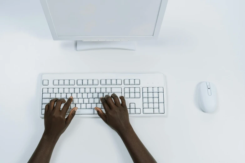 a person is typing on a computer keyboard, by Carey Morris, trending on unsplash, computer art, white background : 3, ebony skin, ignant, high - angle view