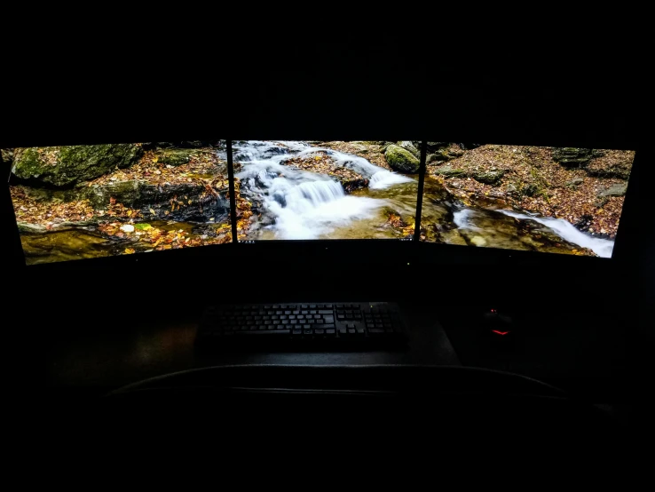 a couple of monitors sitting on top of a desk, by Dan Frazier, unsplash, video art, triptych, ambient cave lighting, 360 degree view, 8k archival print