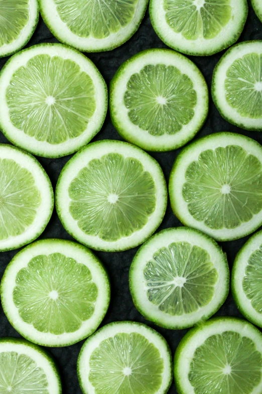 a group of lime slices sitting on top of each other, by Alison Geissler, trending on unsplash, fine art, award-winning crisp details”, ja mong, emerald, 🍸🍋