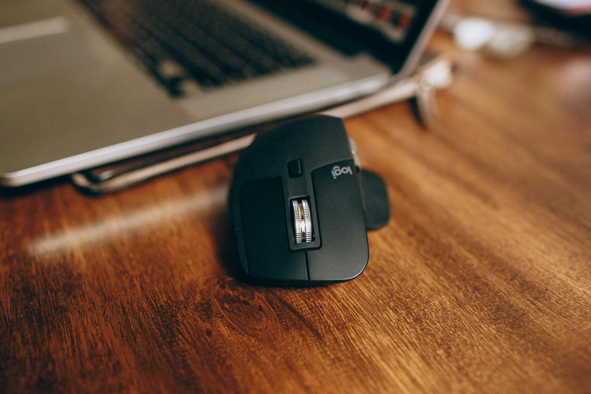 a computer mouse sitting on top of a wooden desk, product image, shot on sony a 7, the argo, instagram picture