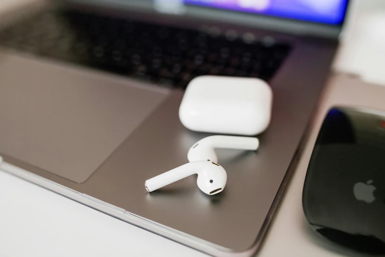 an apple airpods sitting on top of a laptop, by Daniel Lieske, trending on pexels, square, 15081959 21121991 01012000 4k, thumbnail