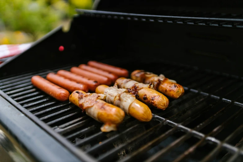 hot dogs and sausages cooking on a grill, by Joe Bowler, pexels contest winner, 🤬 🤮 💕 🎀, thumbnail, sam leach, highly mechanical