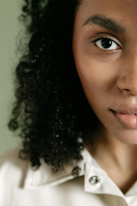 a close up of a person with a cell phone, a character portrait, by Lily Delissa Joseph, trending on pexels, renaissance, brown skin. light makeup, soft lulling tongue, neutral focused gaze, mouth slightly open