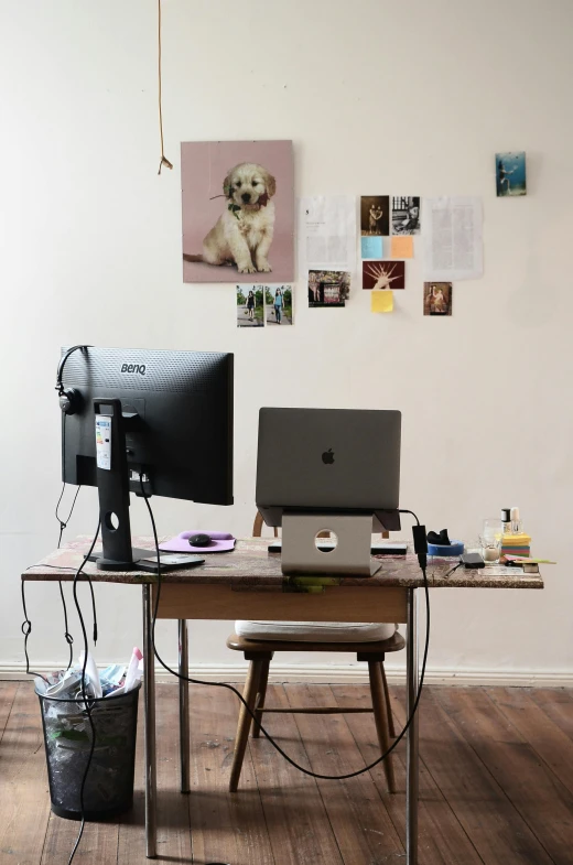 a laptop computer sitting on top of a wooden desk, by Sara Saftleven, posters on the wall, four legged, profile image, messy room