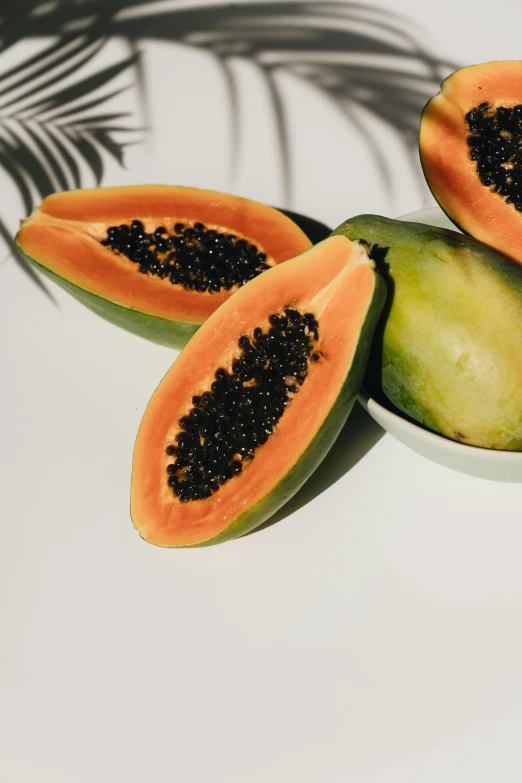 a bowl of papanas sitting on top of a table, by Gavin Hamilton, trending on pexels, hurufiyya, in shades of peach, seeds, tropical plants, high-body detail