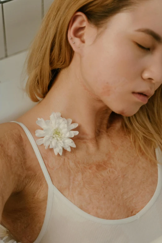 a woman laying in a bathtub with a flower in her hair, inspired by Elsa Bleda, trending on pexels, chest hair, scales covering her chest, a plaster on her cheek, wearing collar on neck