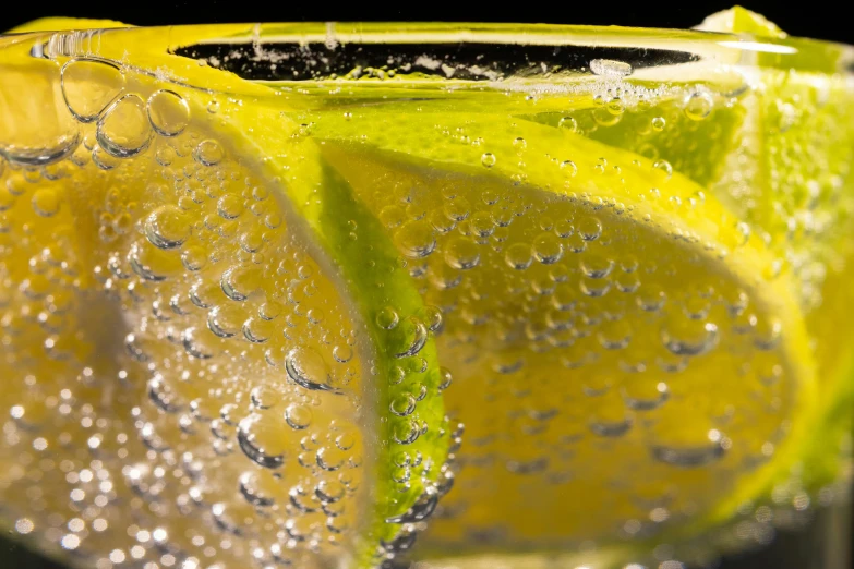 a close up of a slice of lemon in a glass of water, by Thomas Häfner, pexels, photorealism, sparkling dew, fan favorite, promo image, thumbnail