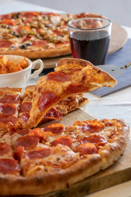 a couple of pizzas sitting on top of a wooden cutting board, zoomed out shot, drinking, 3 - piece, buzzed sides