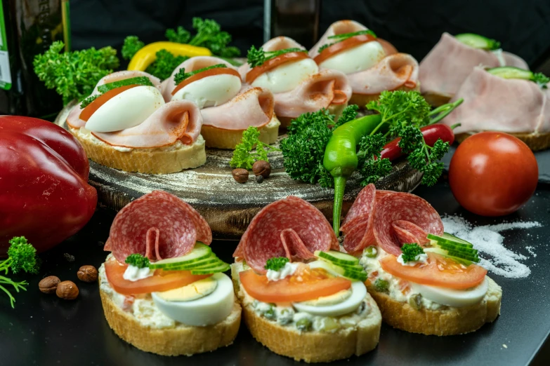 a table topped with lots of different types of food, inspired by Albert Paris Gütersloh, pexels contest winner, art nouveau, sandwich, thumbnail, hasbulla, various posed