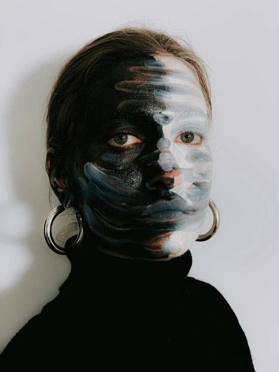a woman with black paint on her face, a hyperrealistic painting, trending on pexels, full - body artwork, portrait of nordic girl, with round face, gray skin