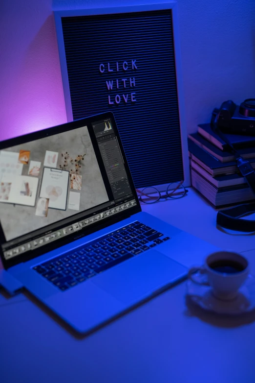 a laptop computer sitting on top of a desk, trending on pexels, computer art, blue lights and purple lights, instagram picture, avatar image, lovecratian