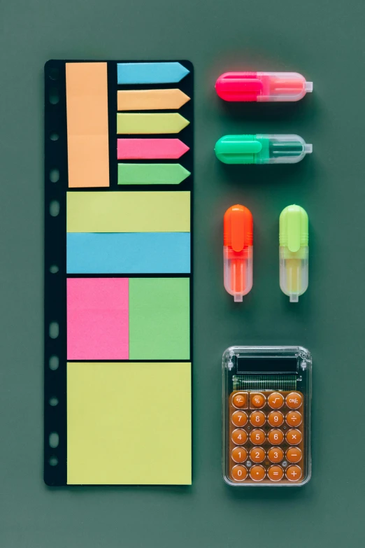 a bunch of office supplies sitting on top of a table, poster art, by Kristian Zahrtmann, pexels, neon color palette, medical labels, golden ration composition, detailed product shot