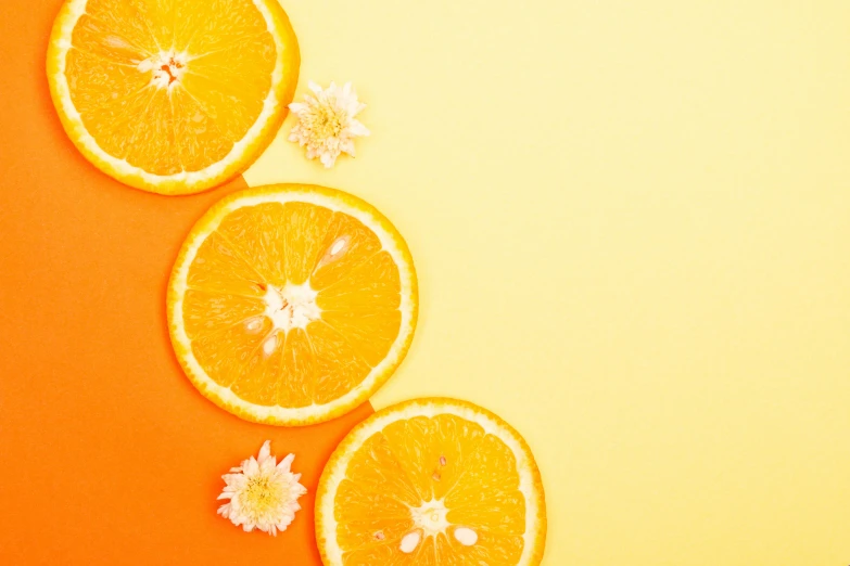 orange slices and flowers on an orange background, trending on pexels, background image, instagram post, yellow wallpaper, 🐿🍸🍋