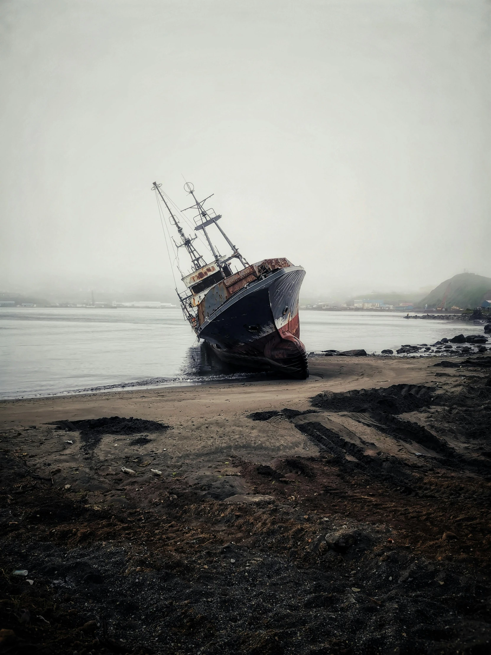 a boat sitting on top of a sandy beach, an album cover, pexels contest winner, auto-destructive art, iceland, dredged seabed, grey, ship