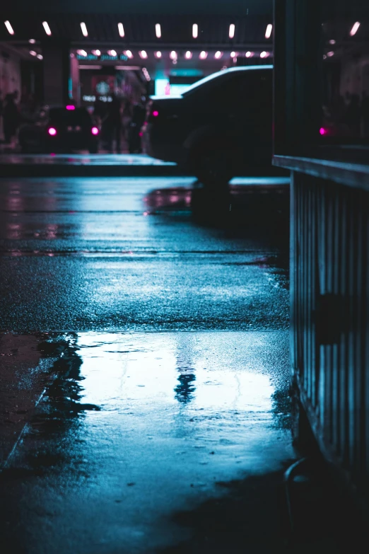 a person walking in the rain with an umbrella, inspired by Elsa Bleda, neon reflections, wet pavement, chillhop, cold blue light