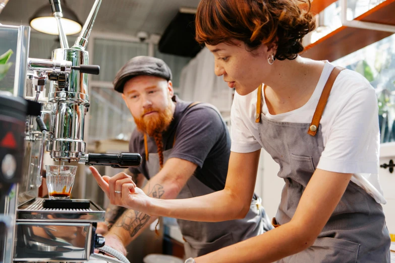 a man and a woman working in a coffee shop, by Lee Loughridge, pexels, “ iron bark, highly mechanical, organic detail, avatar image