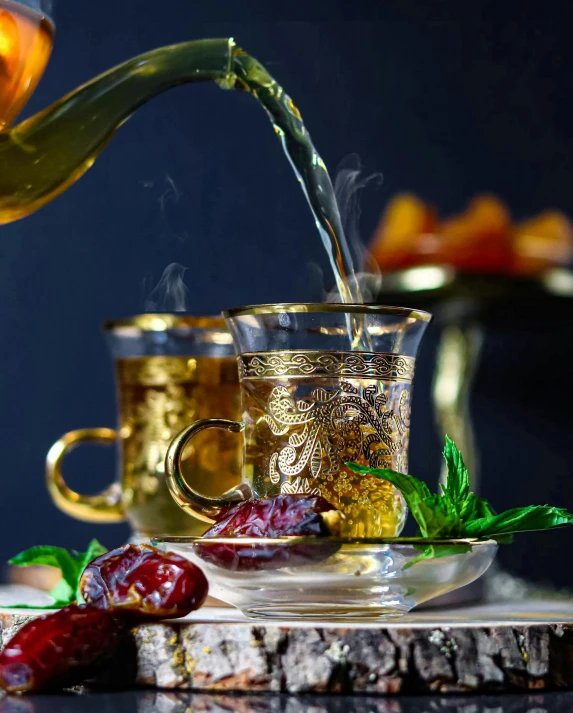 a tea pot pouring tea into a cup, a still life, by Julia Pishtar, trending on pexels, arabesque, middle eastern details, glass and gold and jade, drinking cocktail, thumbnail