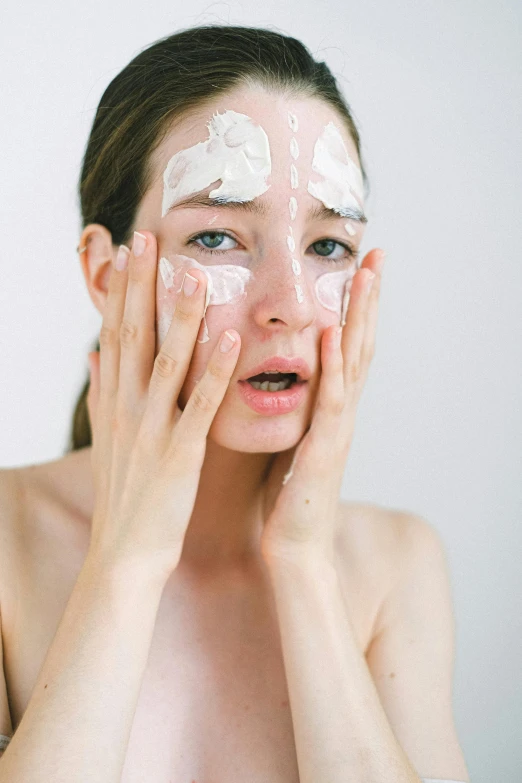 a woman with a lot of cream on her face, trending on pexels, square, cutout, freezing, perfect body face and hands