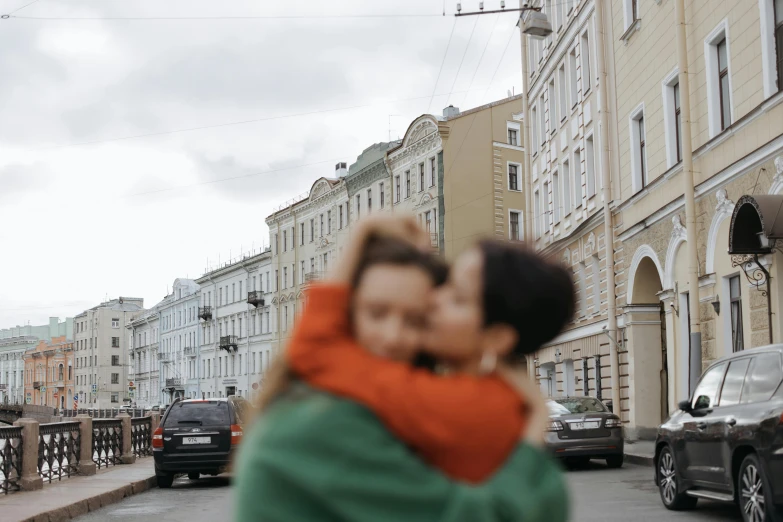 a couple of people that are standing in the street, pexels contest winner, romanticism, portrait of two girls kissing, in russia, square, gif