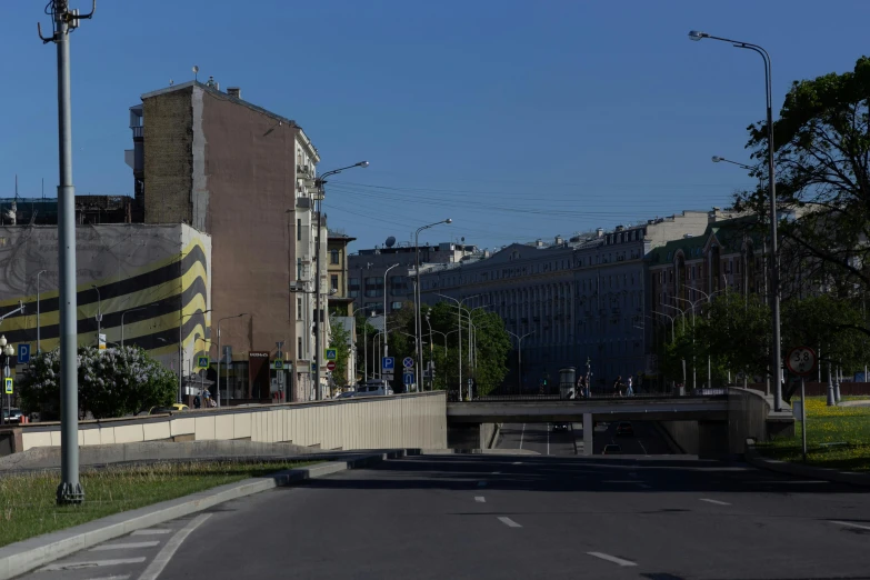 a street filled with lots of traffic next to tall buildings, unsplash, socialist realism, a cathedral under an overpass, 000 — википедия, street art 8 k, panoramic