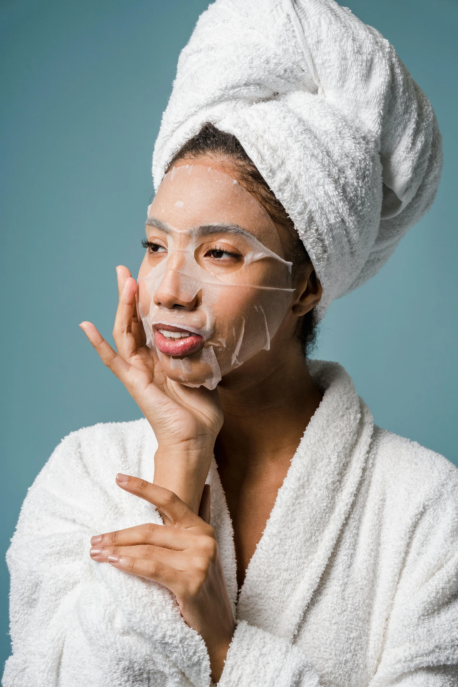 a close up of a person with a towel on their head, pleasing face, cracked plastic wrap, modelling, symetrical facial