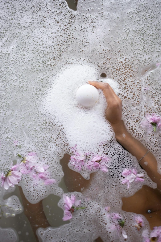 a woman taking a bubble bath in a bathtub, by Cosmo Alexander, trending on pexels, renaissance, flowing sakura silk, sphere, white foam, shot from above