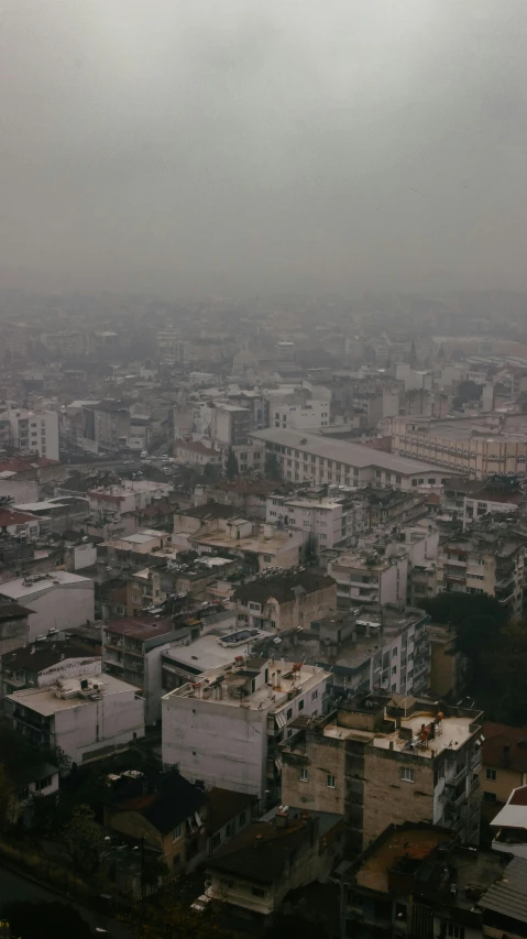 a view of a city from the top of a building, an album cover, pexels contest winner, brutalism, air pollution, vietnam, grey, turkey