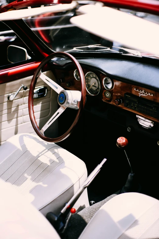 a close up of the interior of a car, a screenshot, pexels contest winner, renaissance, alfa romeo project car, vintage theme, profile image, wide high angle view