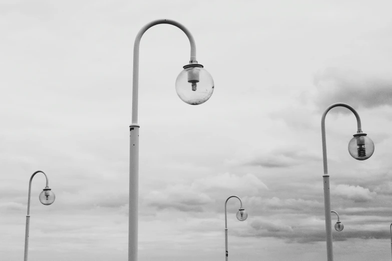 a black and white photo of a street light, unsplash, postminimalism, glass domes, seaside, instagram post, gray