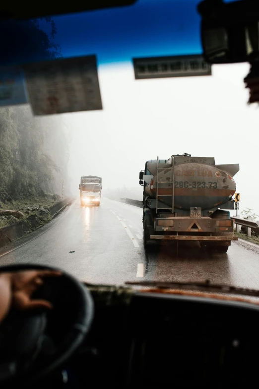 a truck driving down the road in the rain, colombia, slide show, thumbnail, tankoban