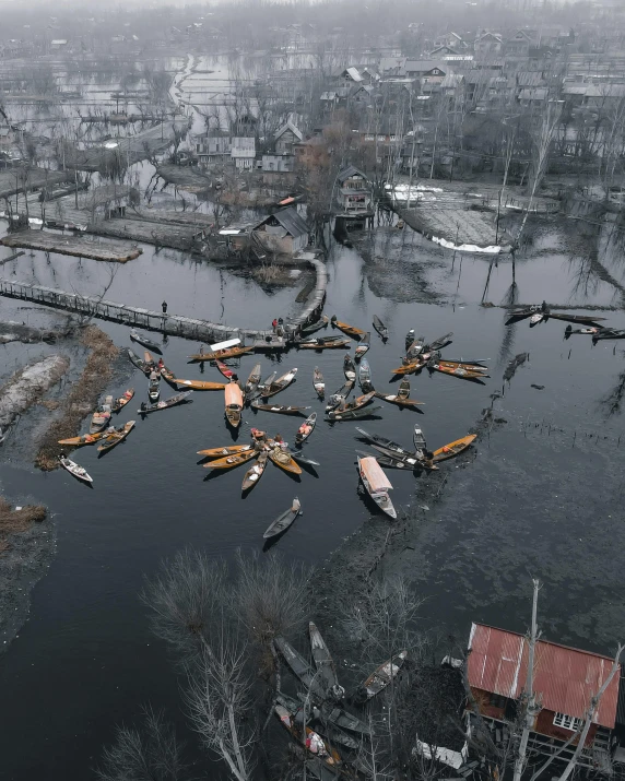 a group of boats floating on top of a river, an album cover, by Attila Meszlenyi, pexels contest winner, hurufiyya, flooding, grey, drones, war in ukraine