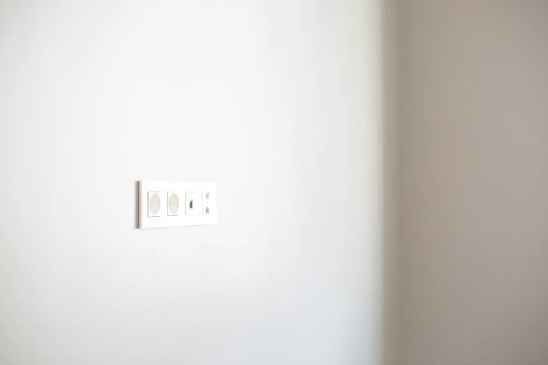 a close up of a light switch on a wall, a minimalist painting, by Jang Seung-eop, 3 light sources, white plastic, recessed