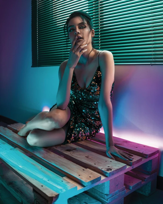 a woman sitting on top of a wooden bench, an album cover, inspired by Elsa Bleda, holography, better known as amouranth, reflecting light in a nightclub, bright vivid color hues:1, glitter dress