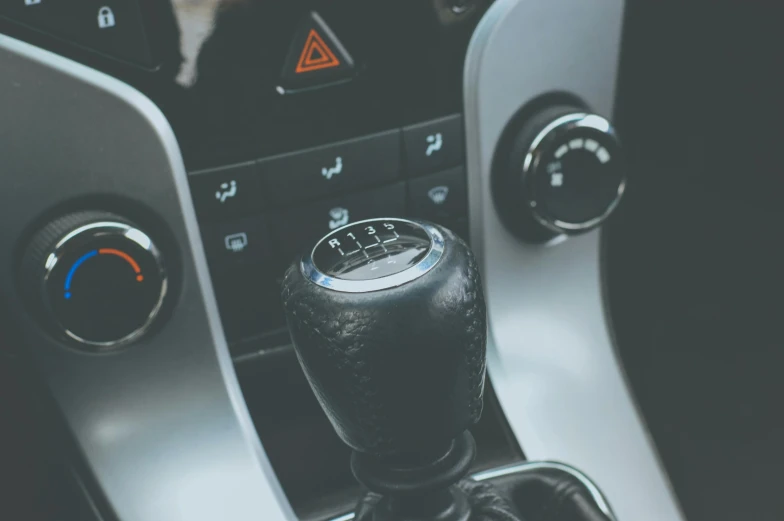 a close up of a gear stick in a car, trending on pexels, “hyper realistic, thumbnail, petrol aesthetic, high - angle view